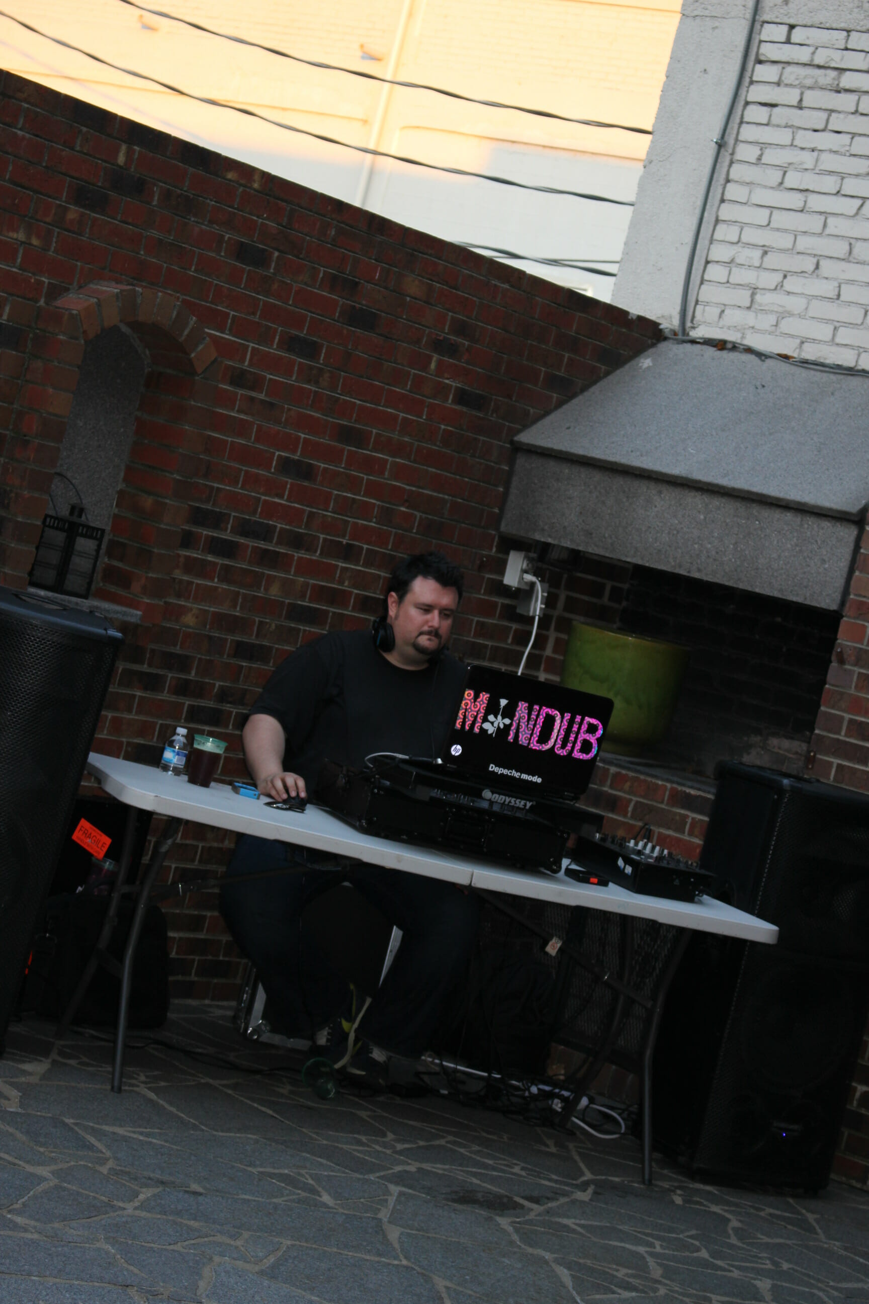 the DJ performing at the AMP summer block party