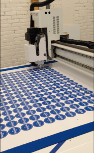 The colex can print hundreds of stickers at once.