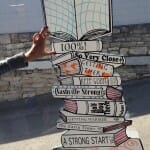 Stack of books sign