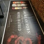 A black and red banner made for Americanborn moonshine