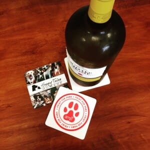 A wine bottle on a print for paws coaster