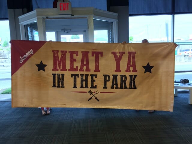 a wide format banner that says "meat ya in the park"